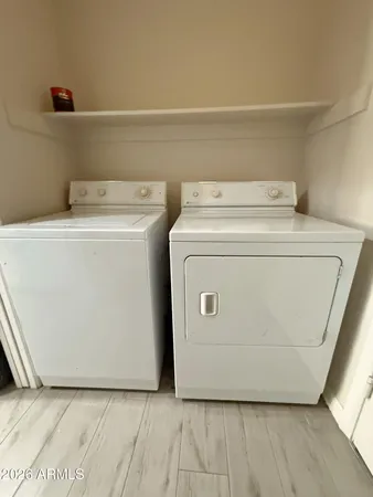 a utility room with dryer and washer