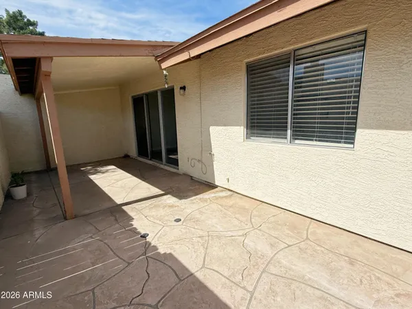a view of a swimming pool with a patio