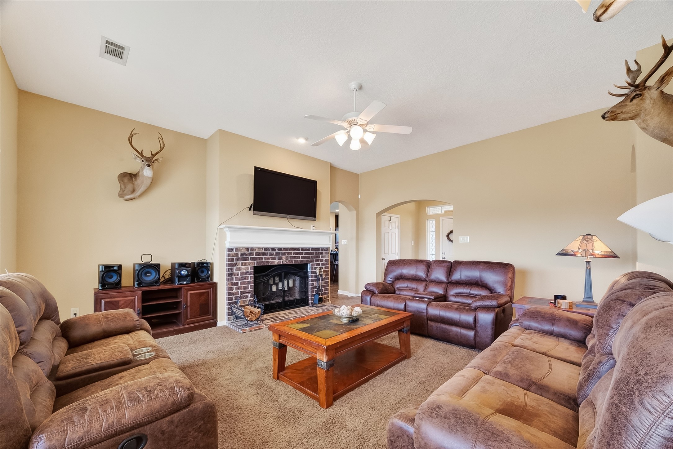 3418 Barbers Hill Road Highlands, TX 77562 - Photo 10 of 50 a living room with furniture fireplace and a flat screen tv