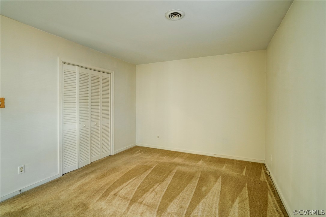 5506 Linda Road Sandston, VA 23150 - Photo 25 of 44 Primary Bedroom has large closet with louvered doors