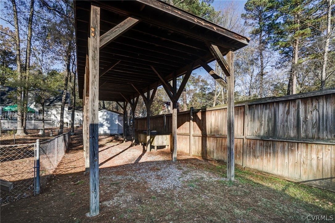 5506 Linda Road Sandston, VA 23150 - Photo 43 of 44 This also has built in holders for trash bins and a trap door to the roof for additional storage!