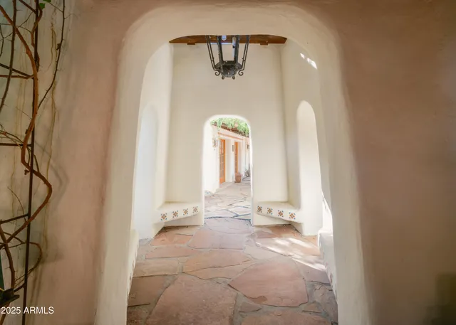 a view of an entryway with a small yard