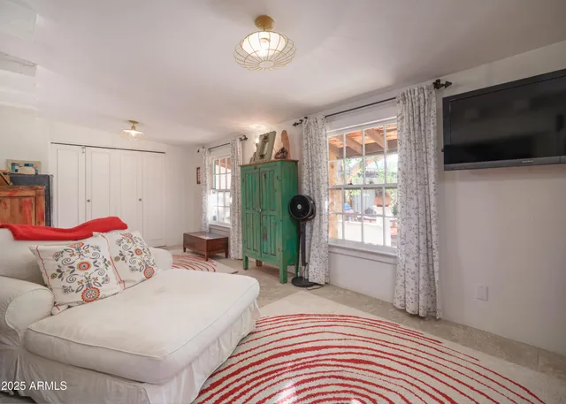 a living room with furniture and a table