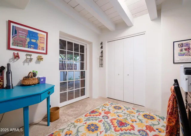 a bedroom with furniture and a window