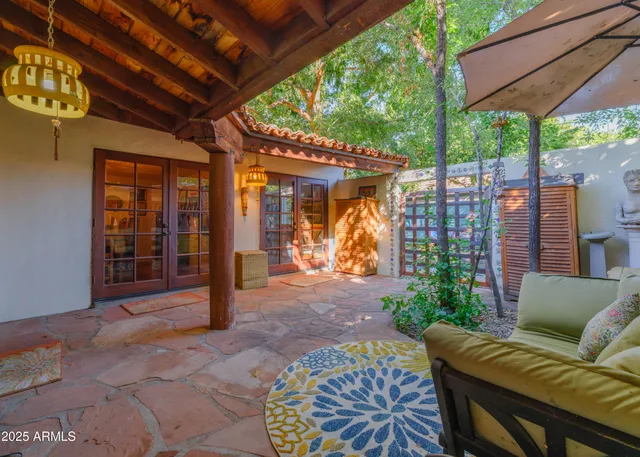 a view of a street with cars parked on the road