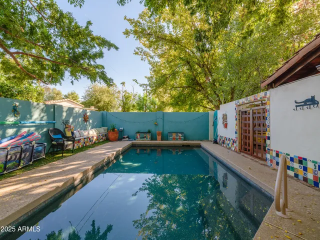 a view of a patio with a table and chairs