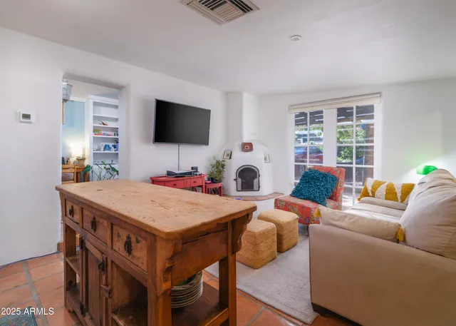 a kitchen with stainless steel appliances granite countertop a stove a sink dishwasher and a refrigerator