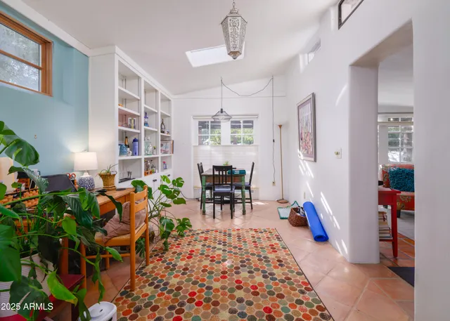 a view of living room with furniture and wooden floor