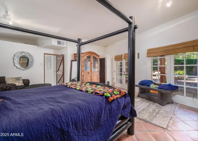 a bed room with furniture and a rug