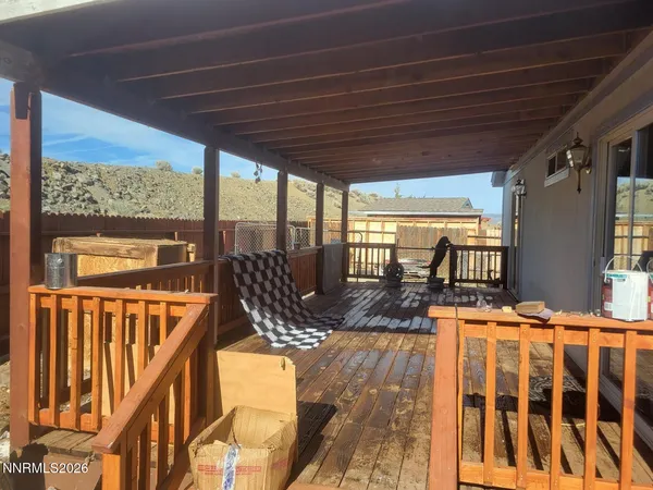a view of a patio with wooden floor