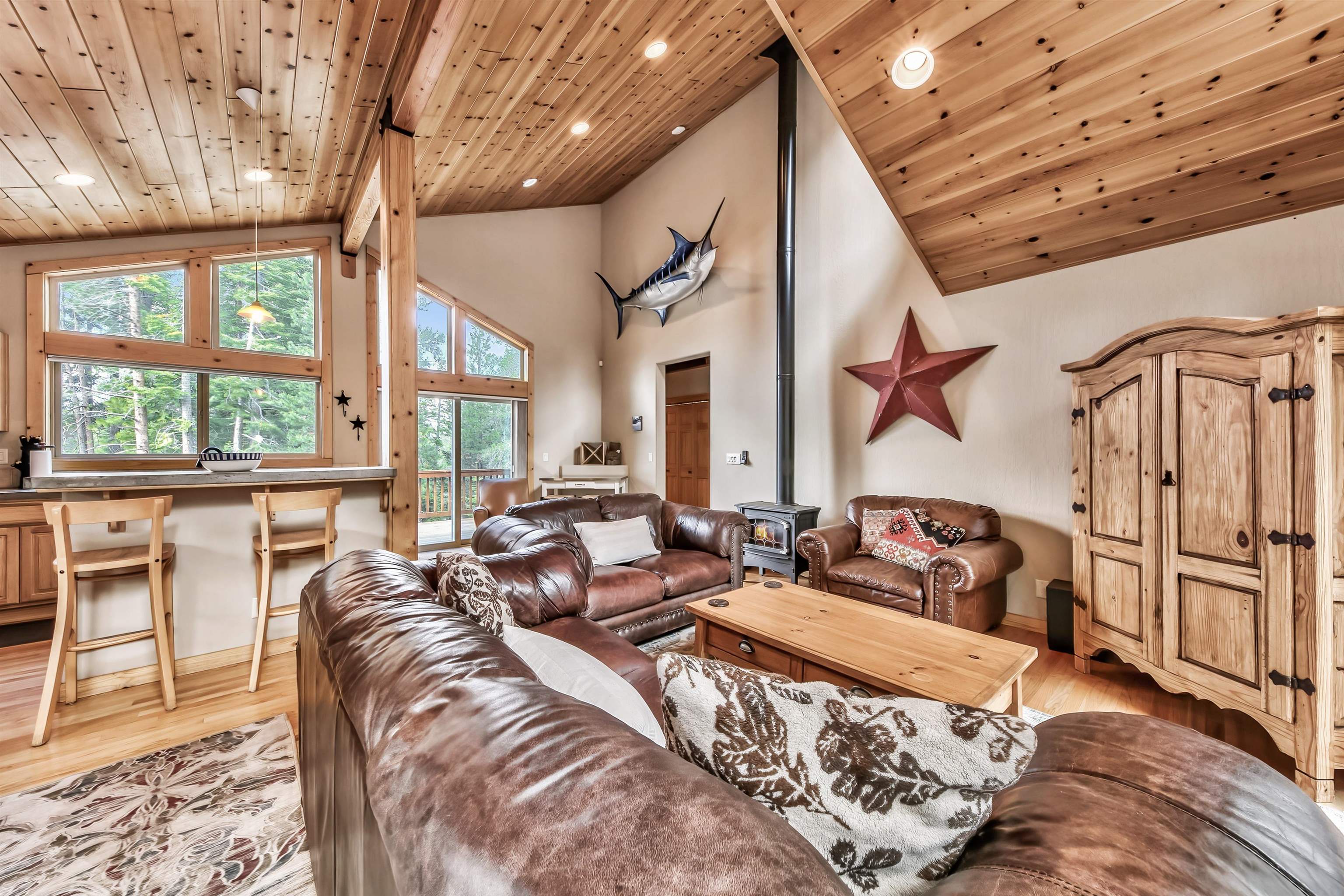 10488 Heather Road Truckee, CA 96161 - Photo 8 of 21 a bed room with furniture and a floor to ceiling window