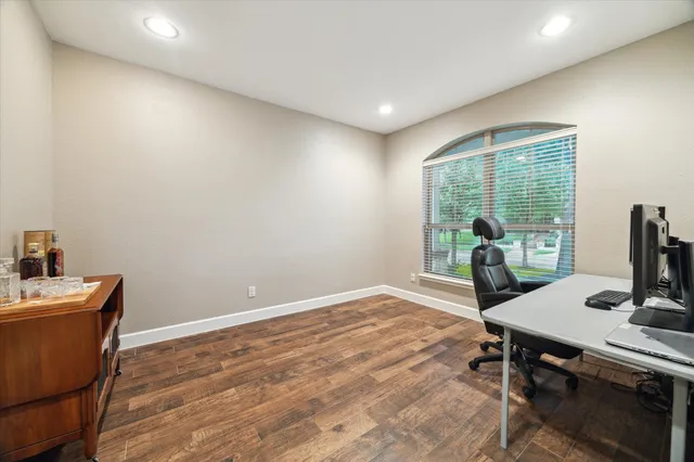 a workspace with furniture and a window