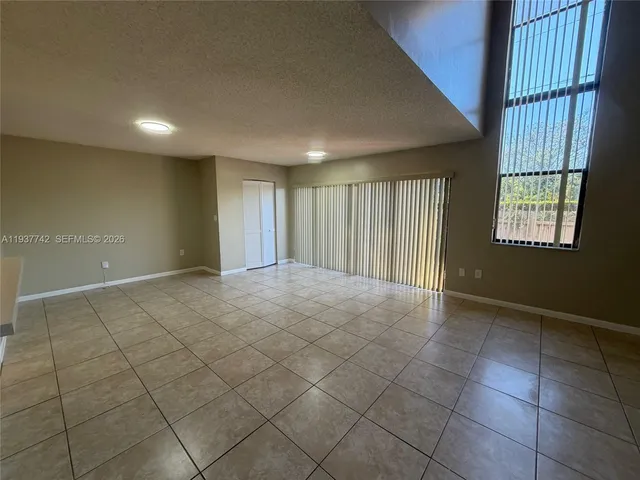a street view with large trees
