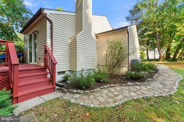 a dining room with furniture a chandelier and window