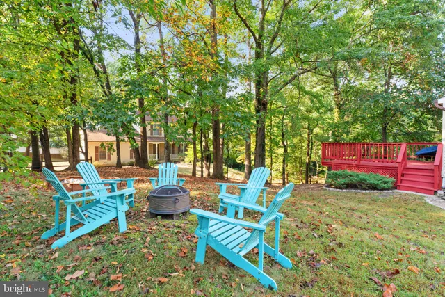 a kitchen with stainless steel appliances granite countertop a sink stove cabinets and a window