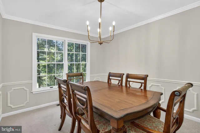 a kitchen with kitchen island stainless steel appliances a sink stove and cabinets