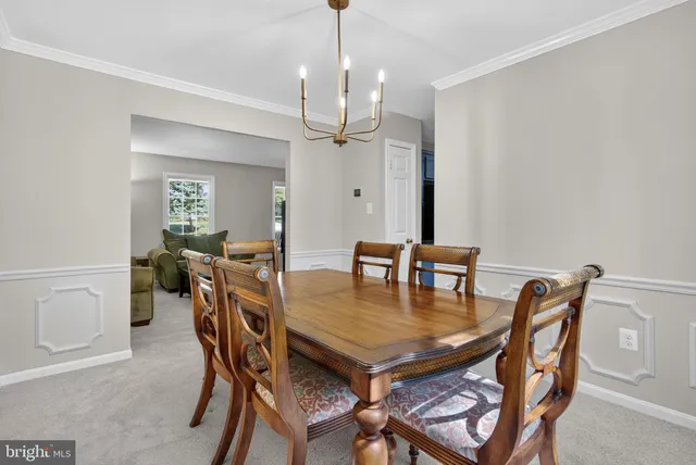 a kitchen with stainless steel appliances granite countertop a kitchen island hardwood floor sink and stove