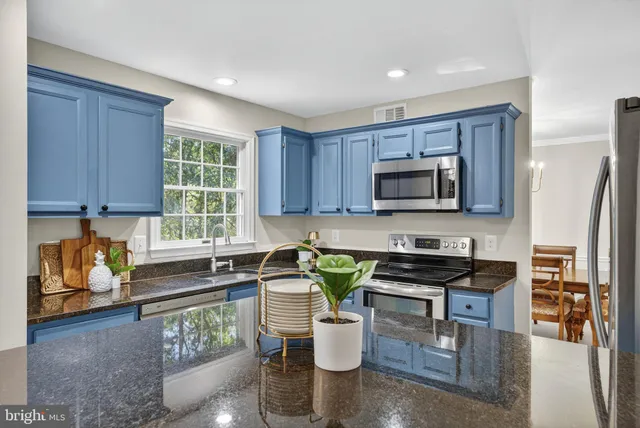 a view of a hallway with wooden shelves