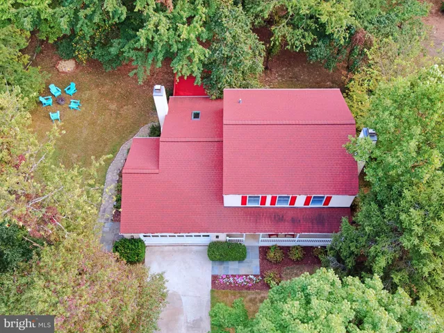 a kitchen with granite countertop a sink stainless steel appliances and cabinets