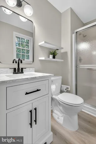 a front view of house with outdoor seating and green space