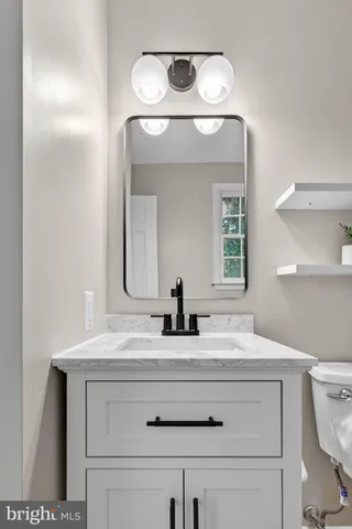 a view of a balcony with wooden floor and fence
