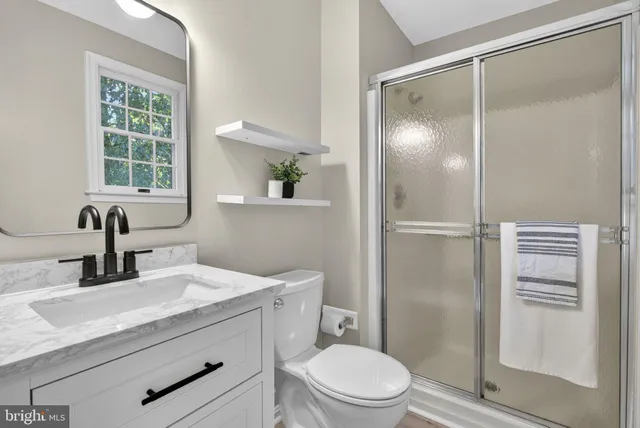 a view of balcony with wooden floor and fence