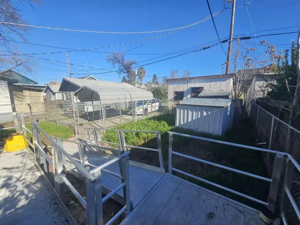 a view of a house with a wooden deck