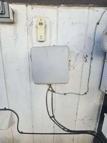 a bathroom with a sink a mirror and wooden floor