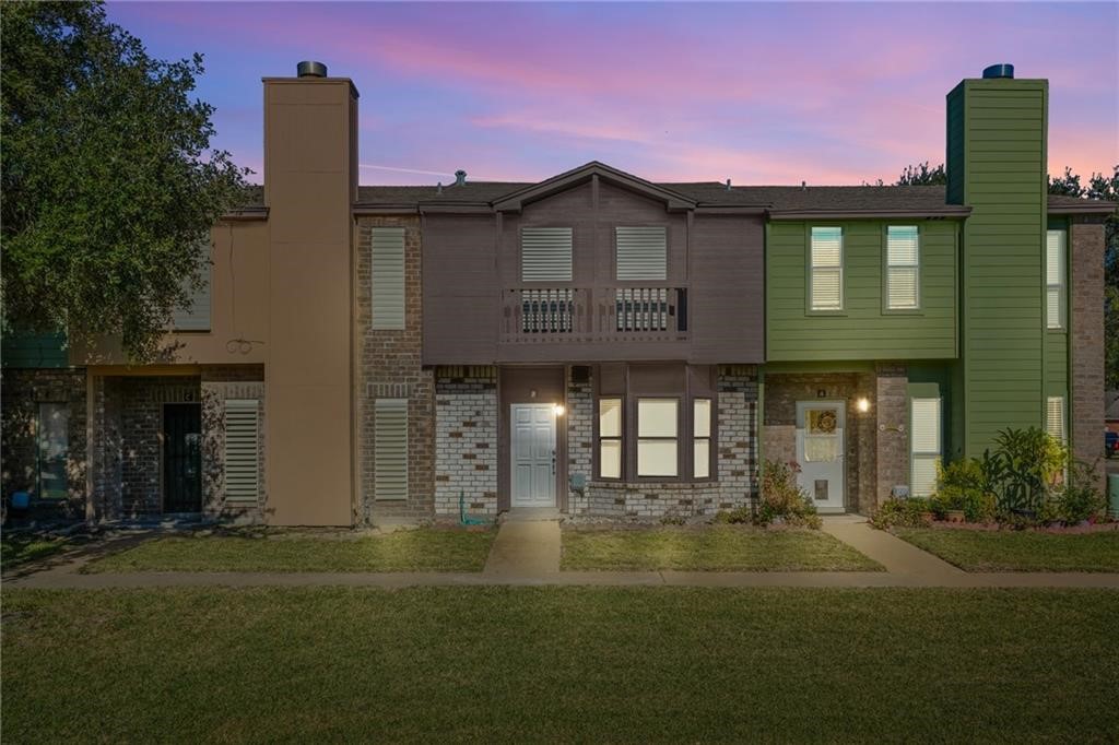 2713 St Joseph Street Corpus Christi, TX 78418 - Photo 1 of 17 a front view of a house with a garden