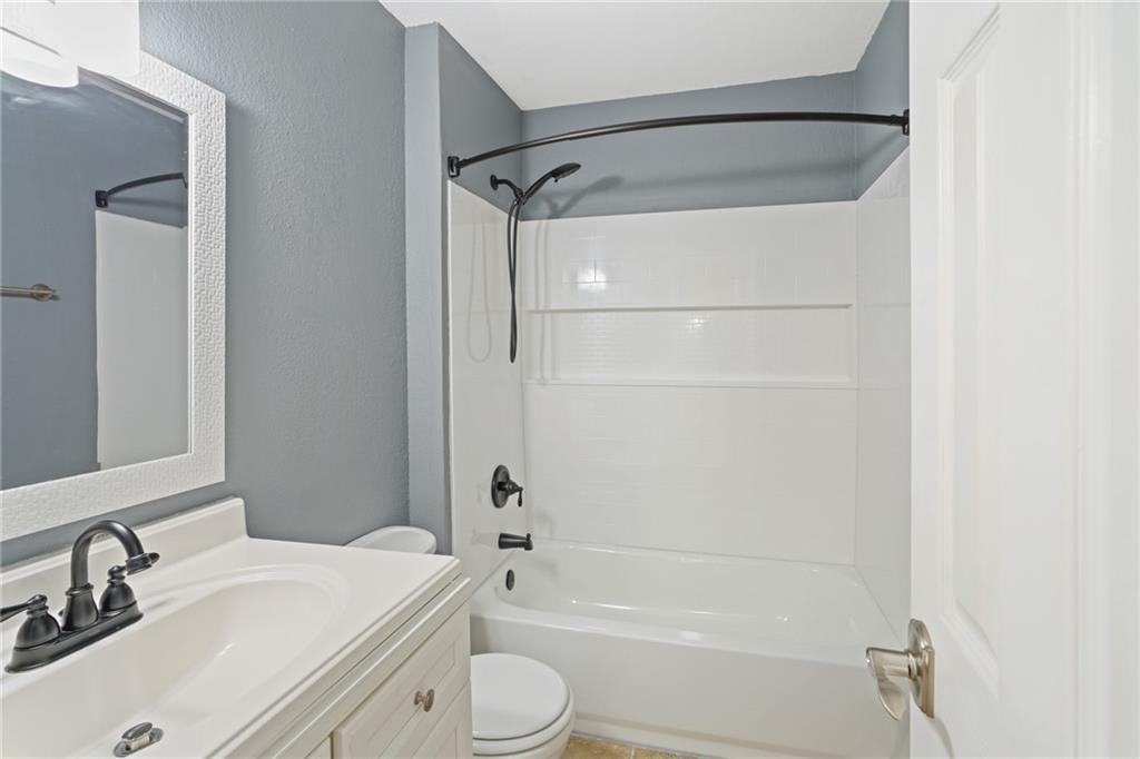 2713 St Joseph Street Corpus Christi, TX 78418 - Photo 14 of 17 a bathroom with a sink toilet and shower