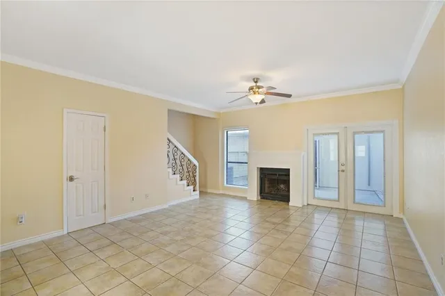 a view of a livingroom with an empty space and a fireplace