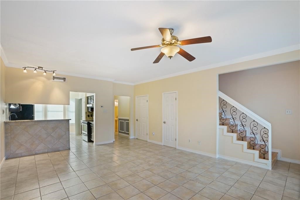 2713 St Joseph Street Corpus Christi, TX 78418 - Photo 4 of 17 a view of a livingroom with furniture and a ceiling fan