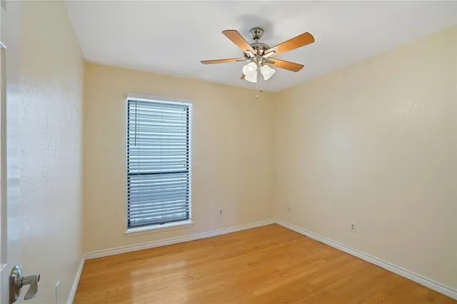 a view of a big room with a ceiling fan