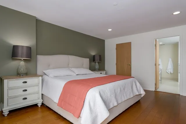 a bedroom with a bed and a tv