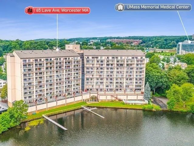 a view of a swimming pool with a yard
