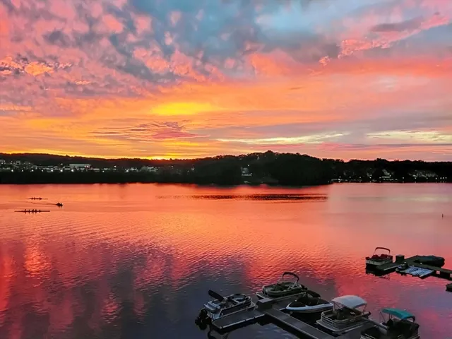 a view of lake with sunset