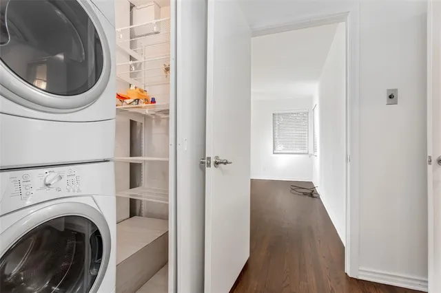 a view of a hallway with washer and dryer