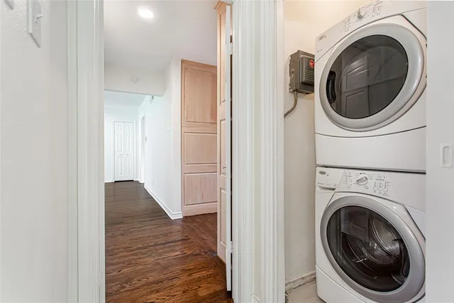 a view of a hallway with washer and dryer