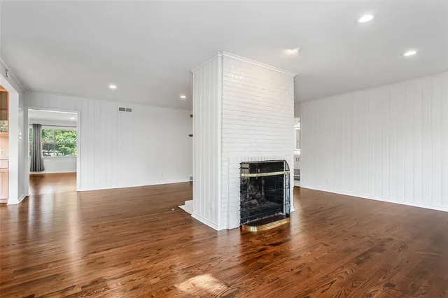 a view of a livingroom with wooden floor