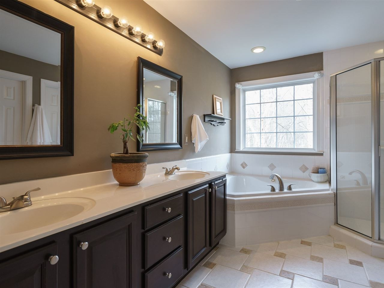 1105 Patterson Grove Road Apex, NC 27502 - Photo 13 of 25 The well-appointed master bath has a dual vanity as well as tile floors. Master Suite