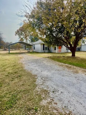 a house with trees in front of it
