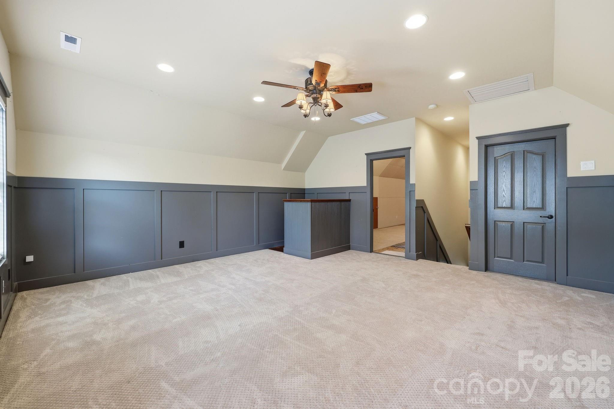 3308 Grandeur Road Charlotte, NC 28269 - Photo 30 of 45 a large room with closet and ceiling fan