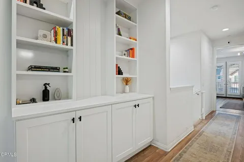 a view of cabinets and wooden floor