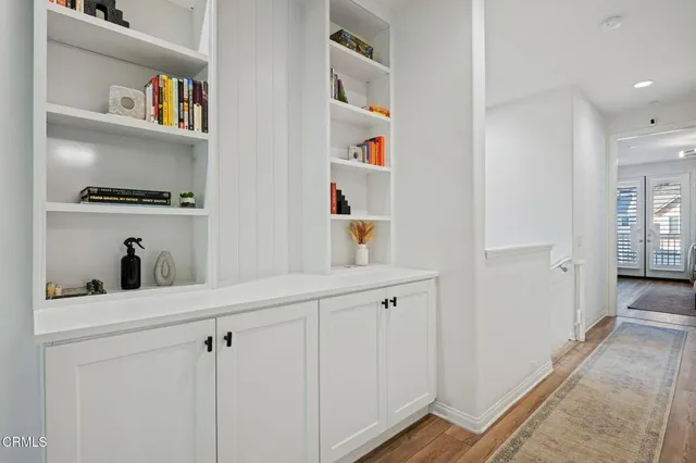 a view of cabinets and wooden floor
