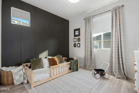 a bedroom with furniture and a window