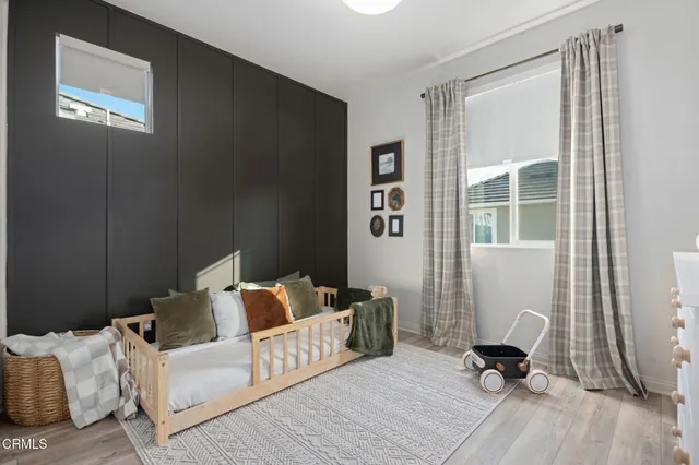 a bedroom with furniture and a window