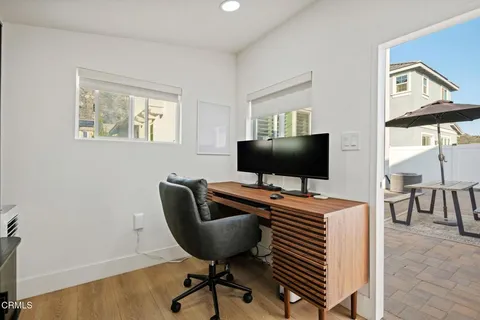a view of a swimming pool with outdoor seating
