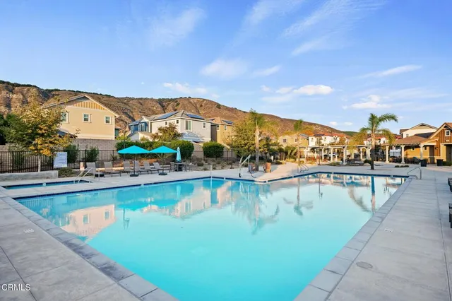 a view of a swimming pool with an outdoor seating