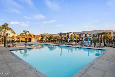 a view of houses with outdoor space and lake view