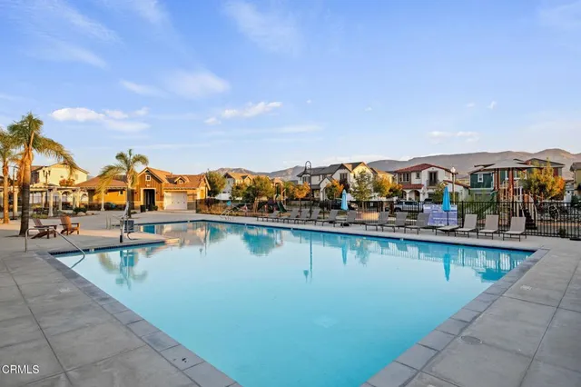 a view of houses with outdoor space and lake view